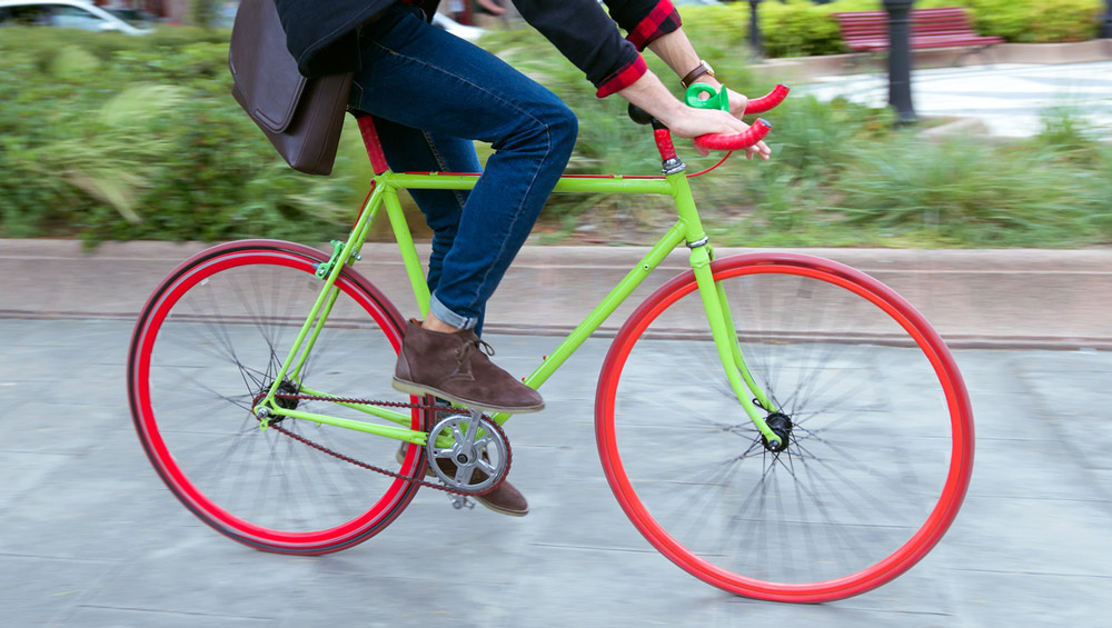 A person riding a colorful bicycle