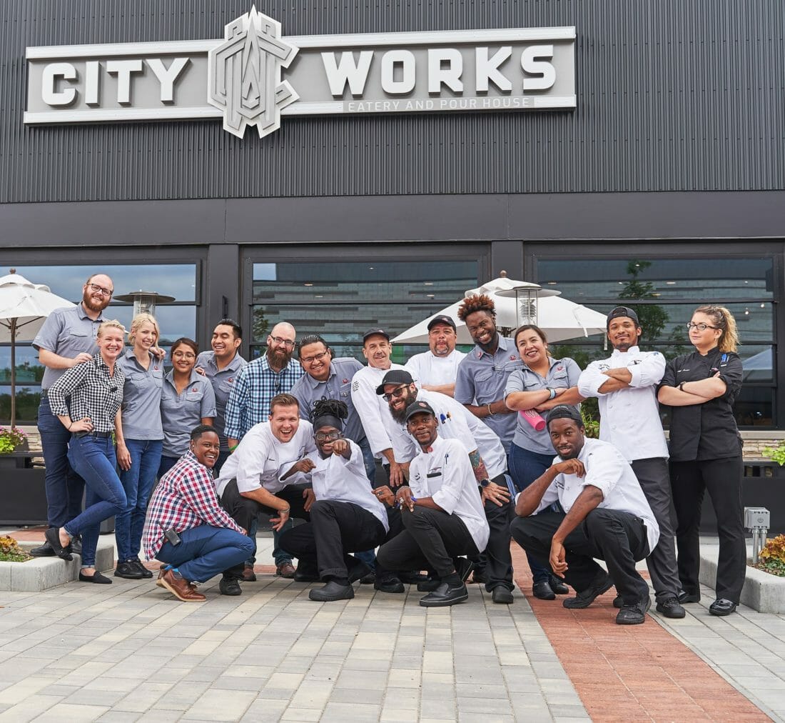 City Works staff posing on the restaurant's patio