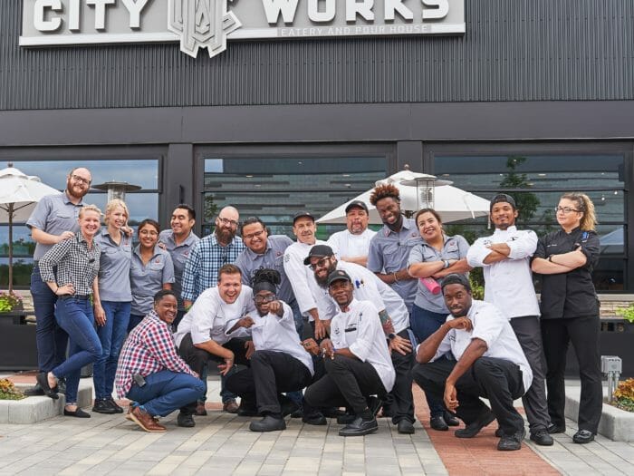 City Works staff posing on the restaurant's patio