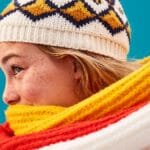 A woman wearing a warm scarf and hat