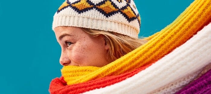 A woman wearing a warm scarf and hat