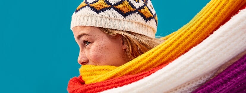 A woman wearing a warm scarf and hat