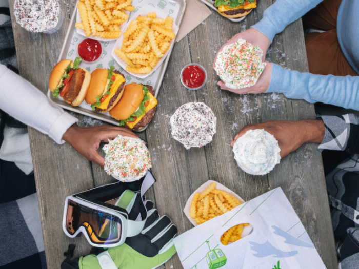 Friends enjoying a meal at Shake Shack