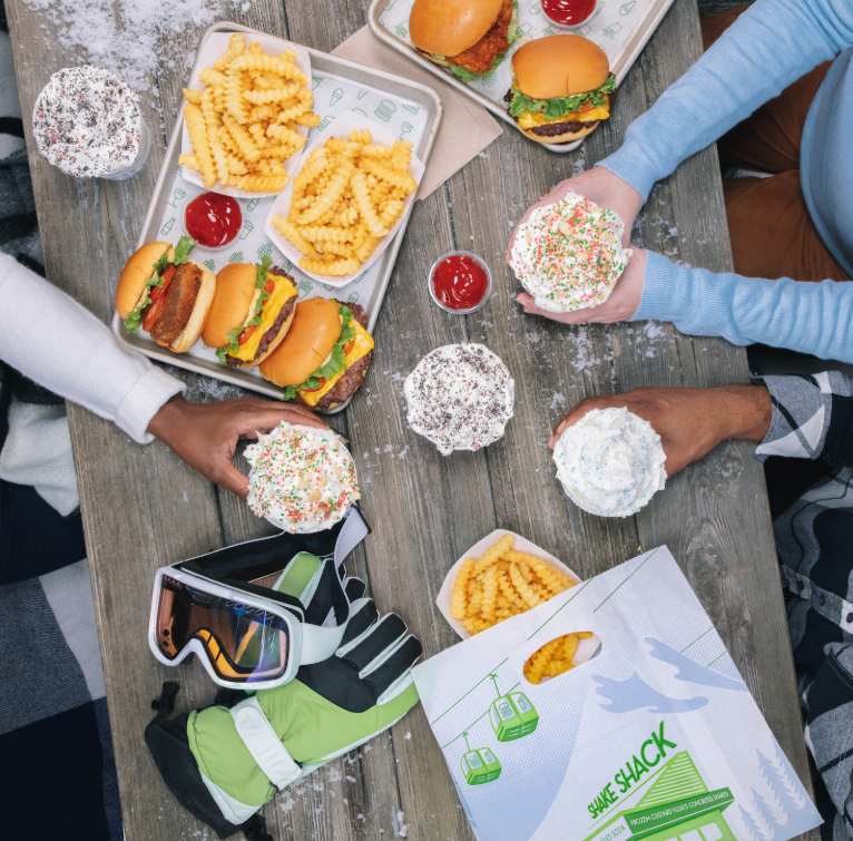 Friends enjoying a meal at Shake Shack